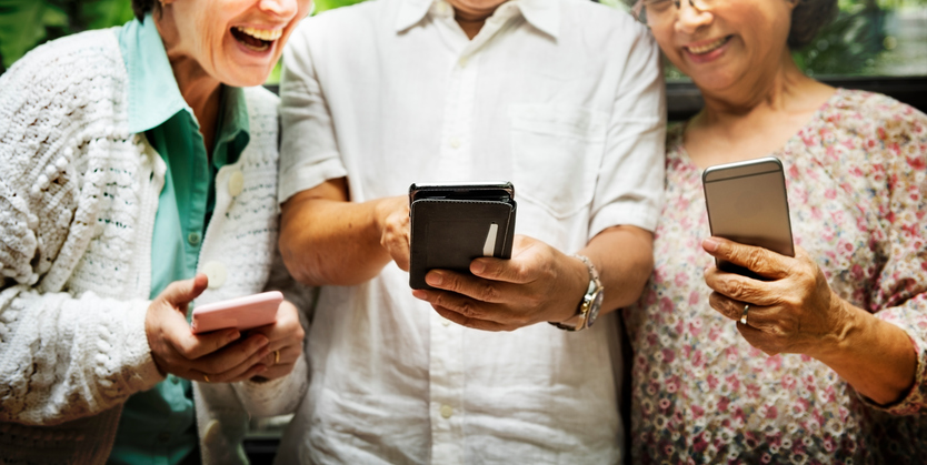 image of three seniors on their smartphones